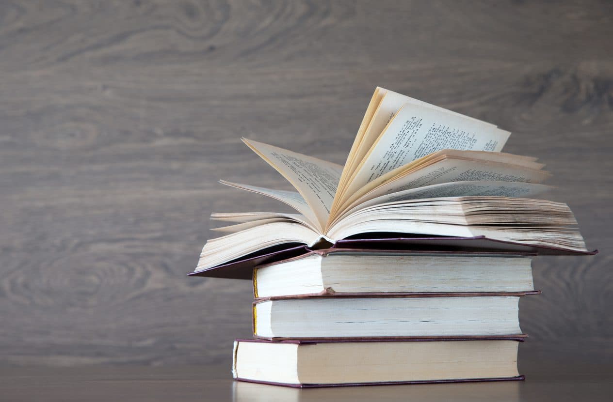 books on wooden deck tabletop